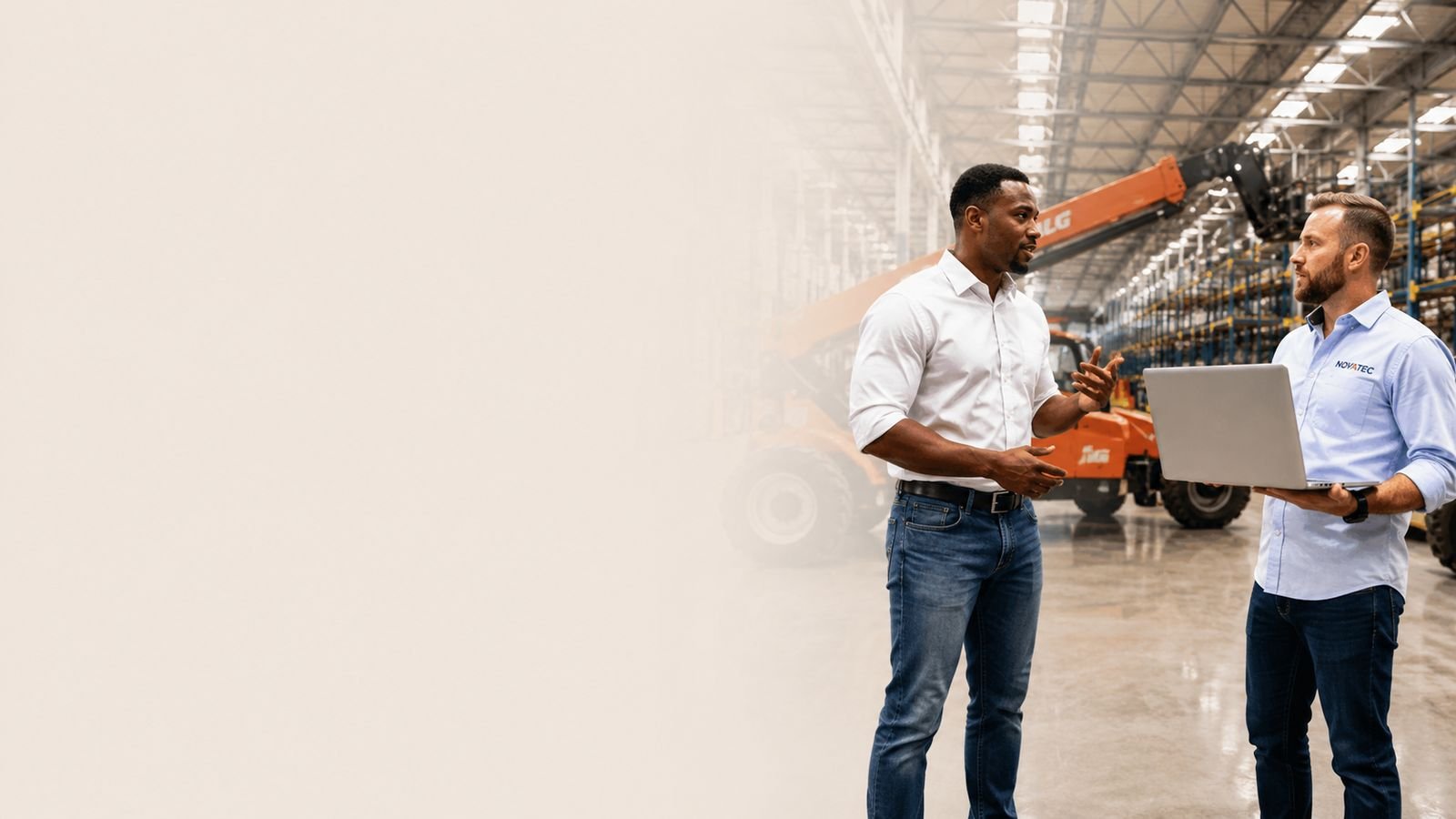 Two Novatec engineers reviewing a plant layout on a laptop on the production floor